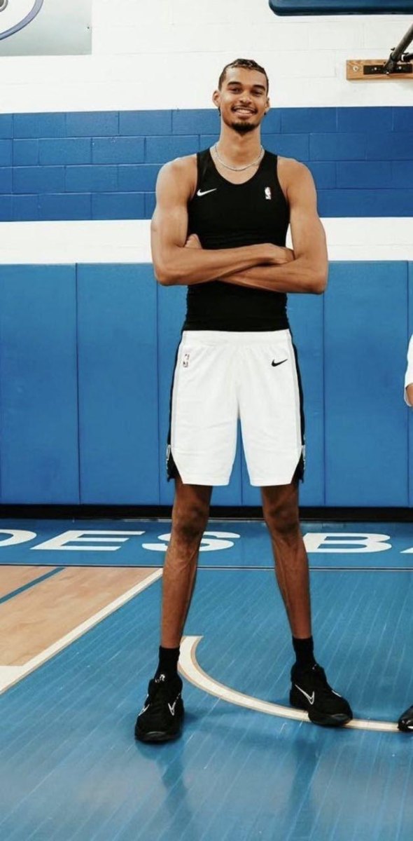 Athletes standing on court