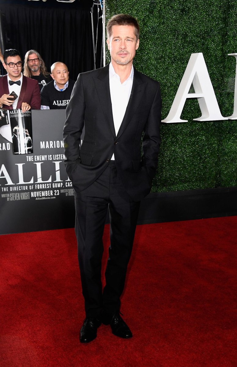 Brad Pitt standing at a film premiere