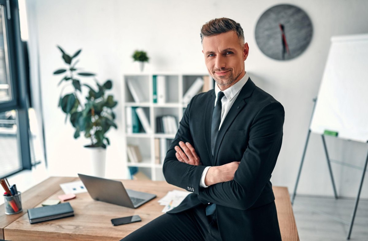 Professional man wearing suit at workplace