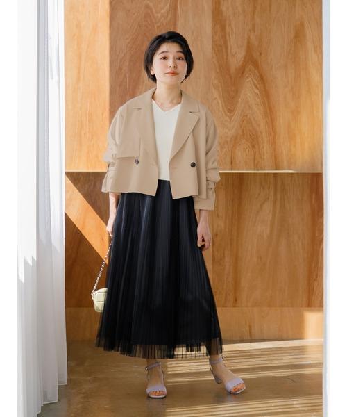 Petite woman wearing balanced layers