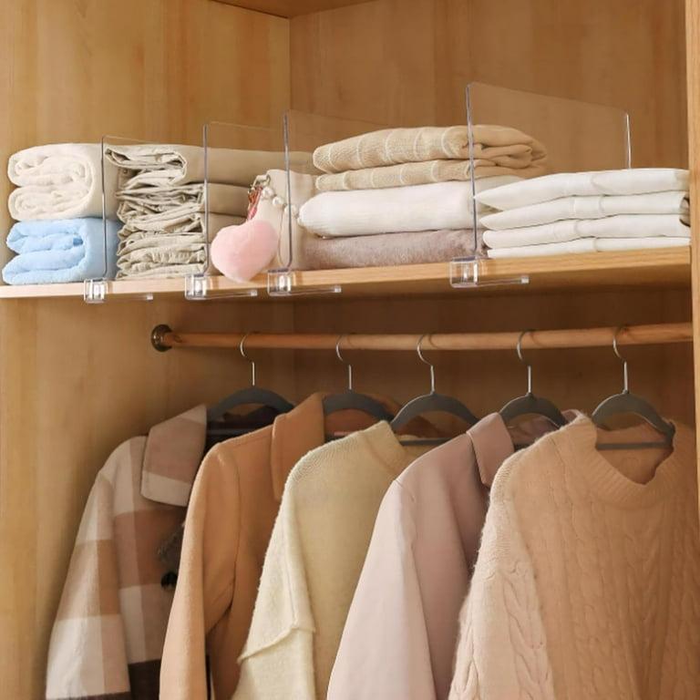 Folded clothes organized with shelf dividers
