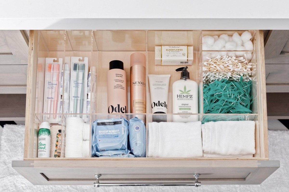 Family bathroom drawer with separate organized sections for individual toiletries