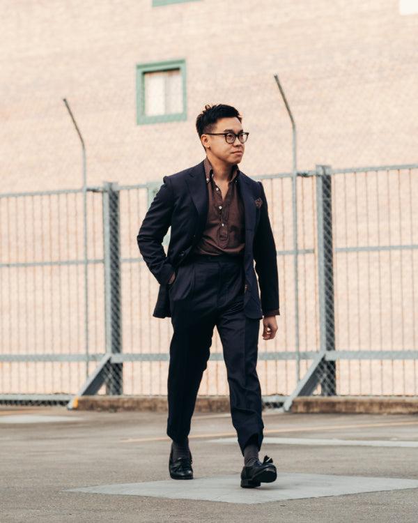 Shorter man wearing fitted stylish clothing