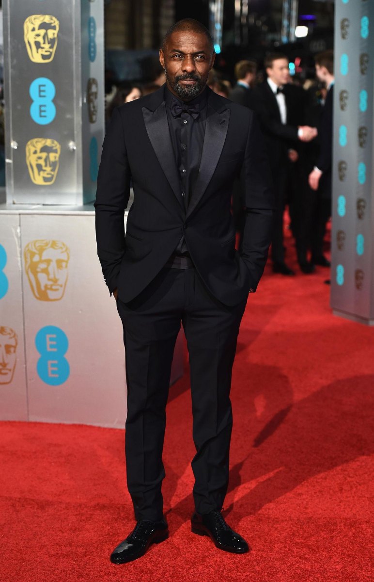 Idris Elba standing at a public event