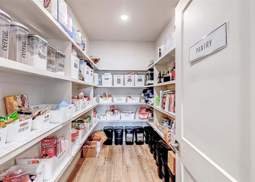 Clearly labeled pantry containers and storage baskets