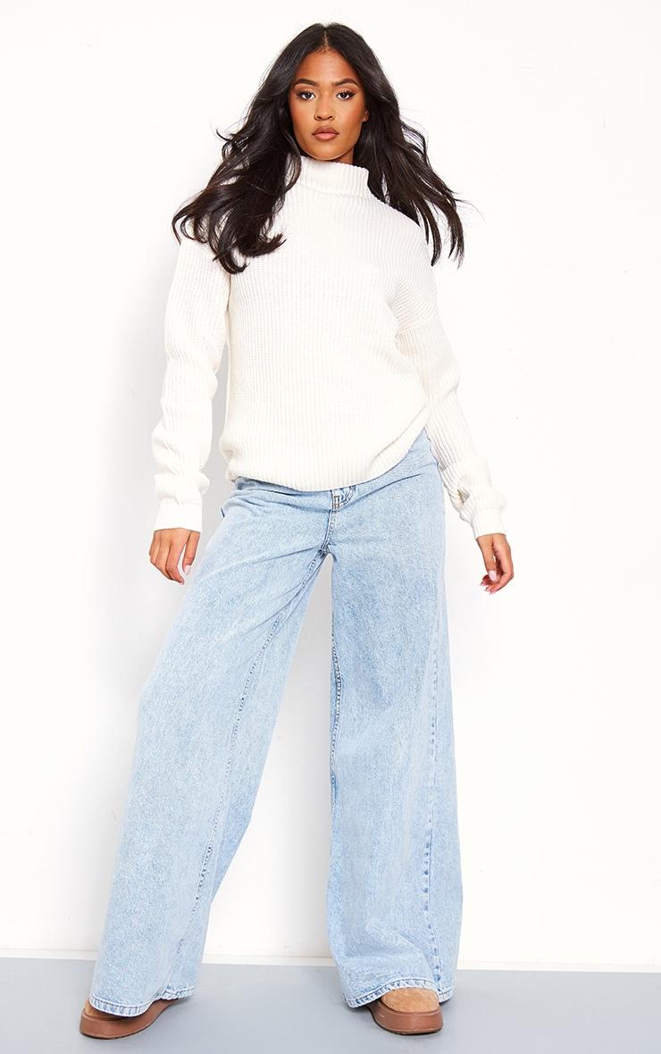 Tall woman wearing layered knitwear