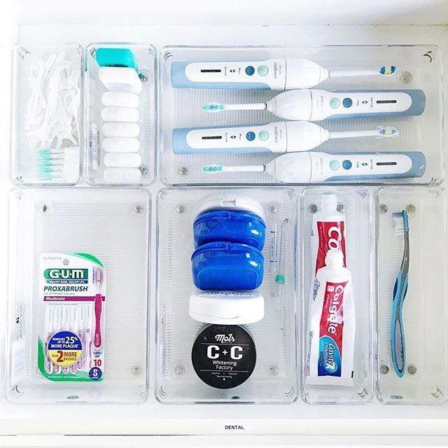 Bathroom drawer organizing toothpaste floss replacement brush heads and dental supplies