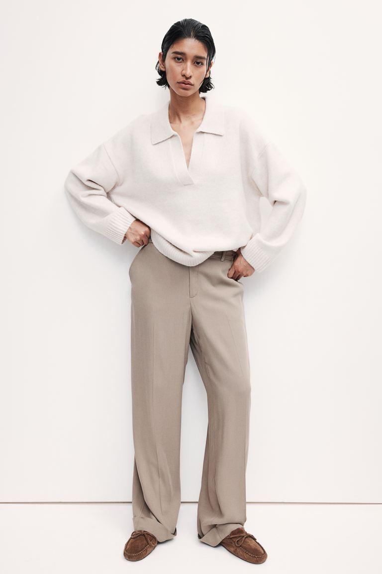 Tall woman in neutral minimalist outfit