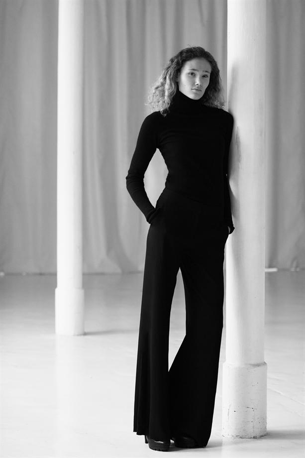 Tall model wearing monochrome outfit