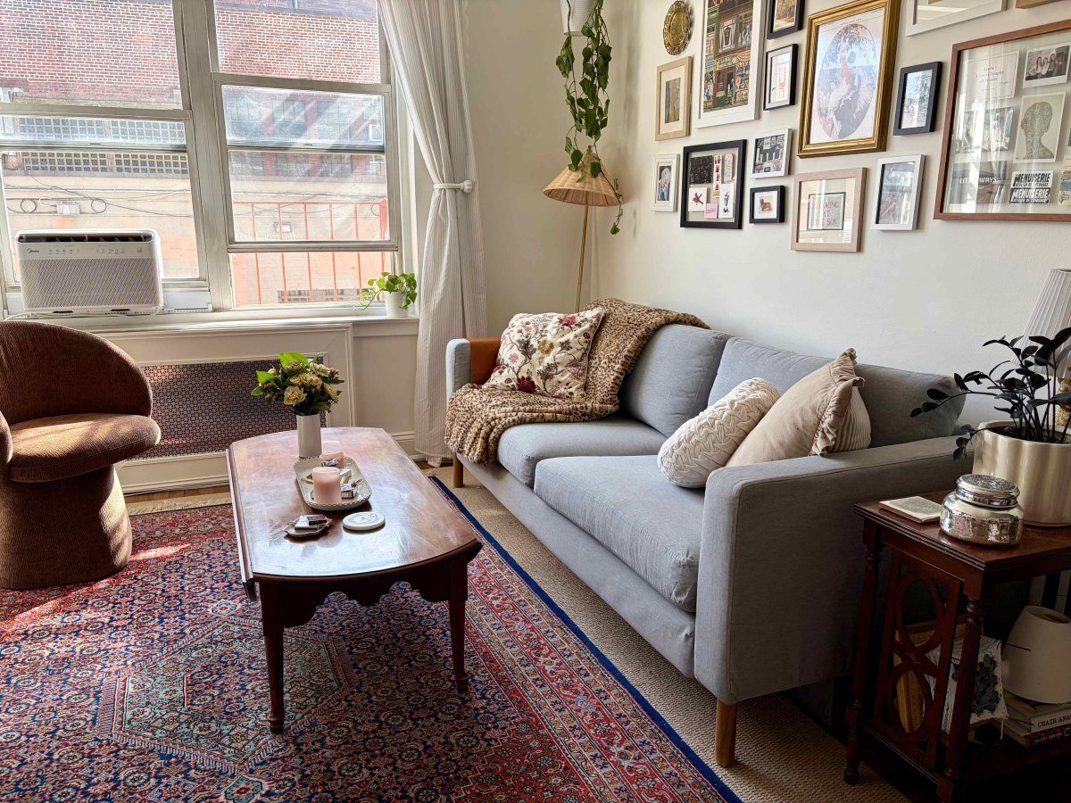 Small apartment living room with layered neutral and patterned rugs