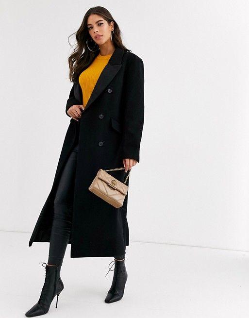 Tall woman wearing statement coat