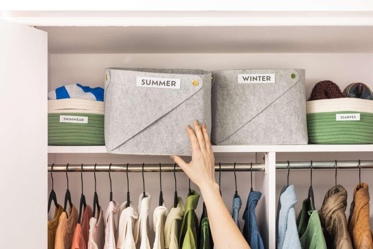 Labeled containers storing seasonal clothes
