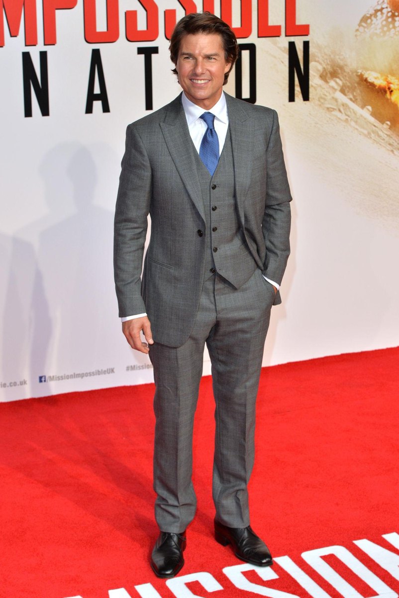 Tom Cruise standing at a film premiere
