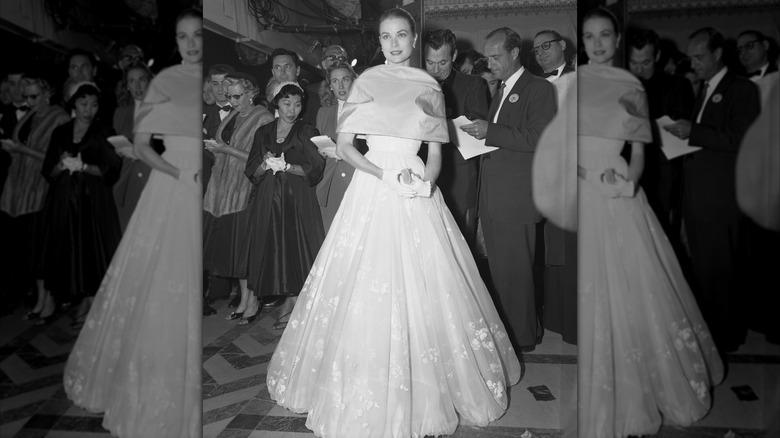 Vintage-inspired black and ivory ball gown with elegant evening gloves