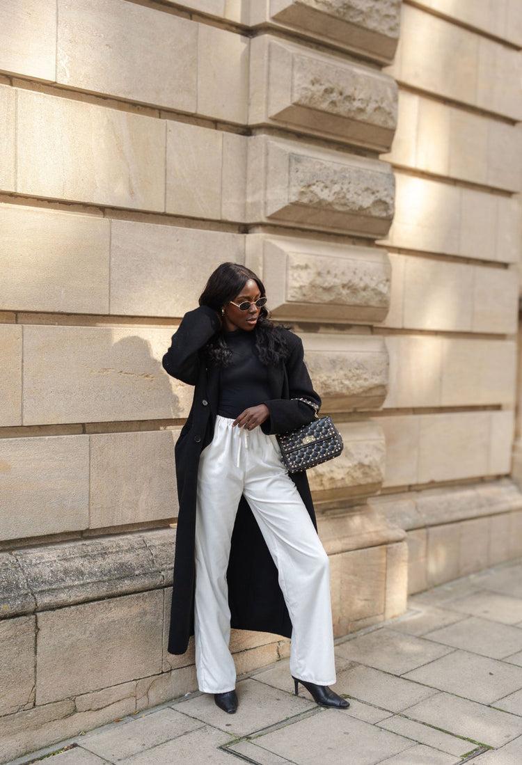 Tall woman wearing wide leg pants